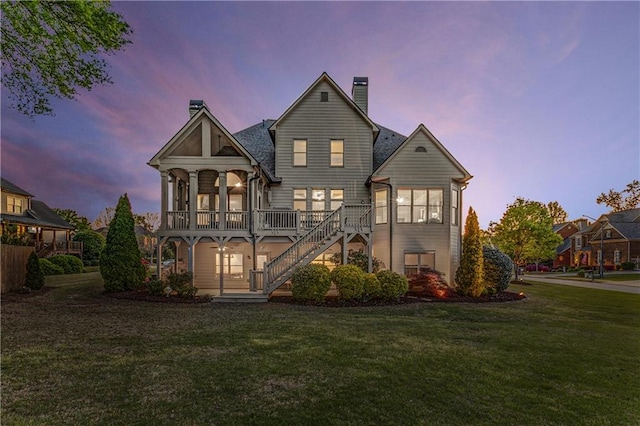 895 Ovalene Ln SW, Marietta, GA 30064 - back of property with a chimney, a yard, and stairs