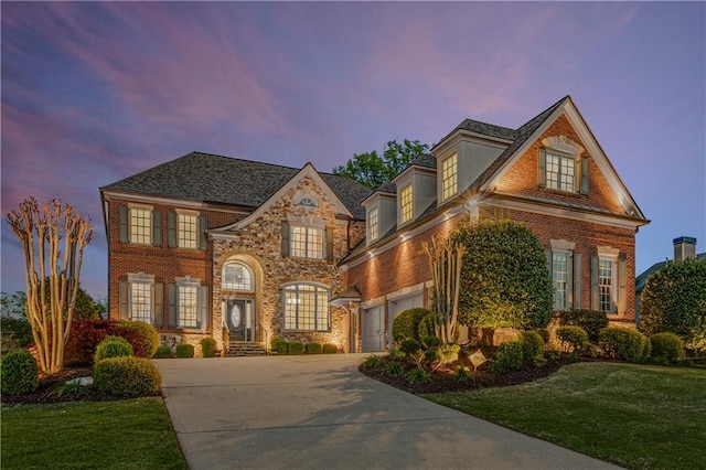 895 Ovalene Ln SW, Marietta, GA 30064 - view of front of house with a yard, driveway, brick siding, and a garage