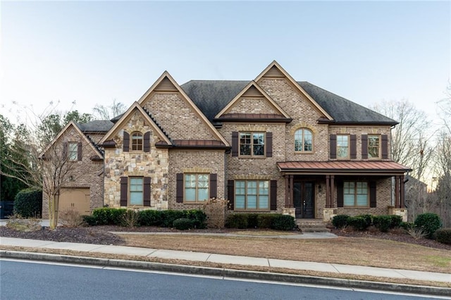 view of front of home with a porch and a garage