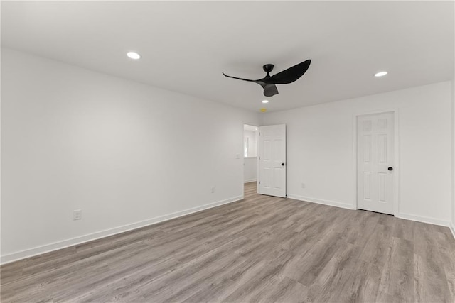 unfurnished room with ceiling fan and light hardwood / wood-style floors