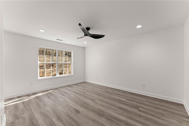 unfurnished room with ceiling fan and hardwood / wood-style floors