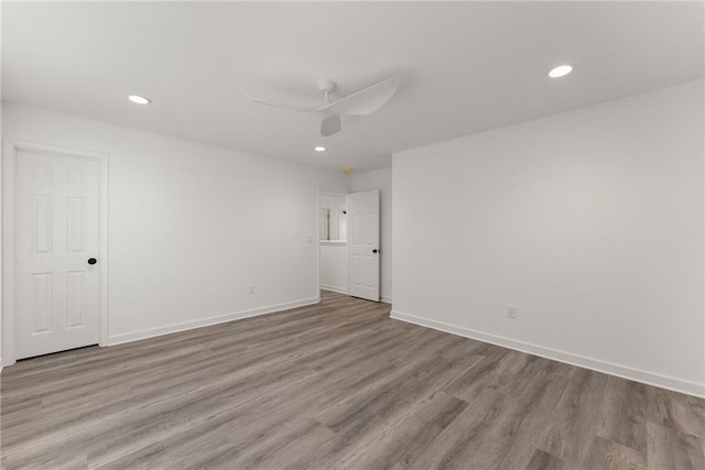 unfurnished room with light wood-type flooring and ceiling fan