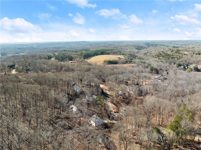 birds eye view of property with a rural view