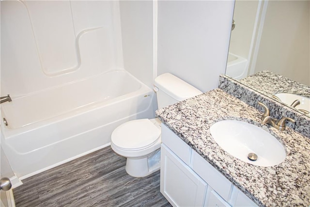 full bathroom featuring shower / tub combination, vanity, toilet, and hardwood / wood-style flooring