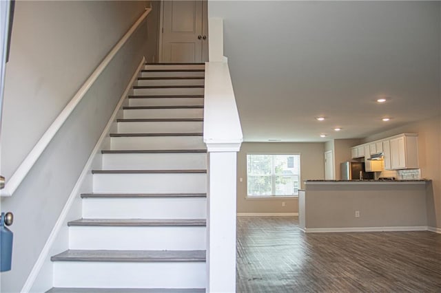 staircase featuring hardwood / wood-style flooring