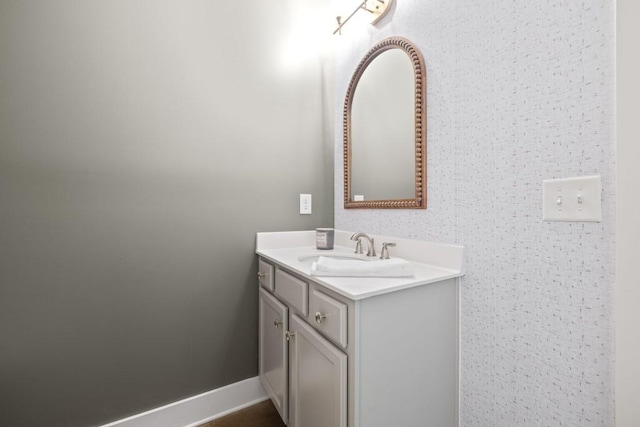 bathroom featuring vanity and baseboards