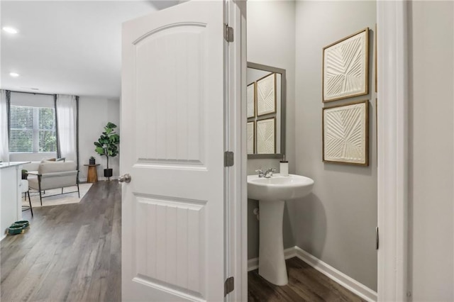 bathroom featuring sink and hardwood / wood-style flooring