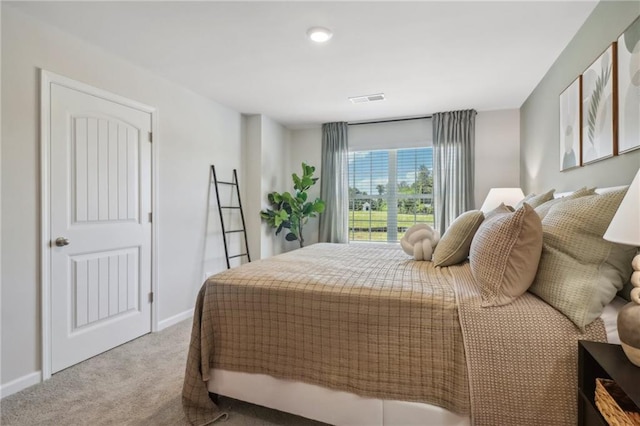 bedroom with light carpet