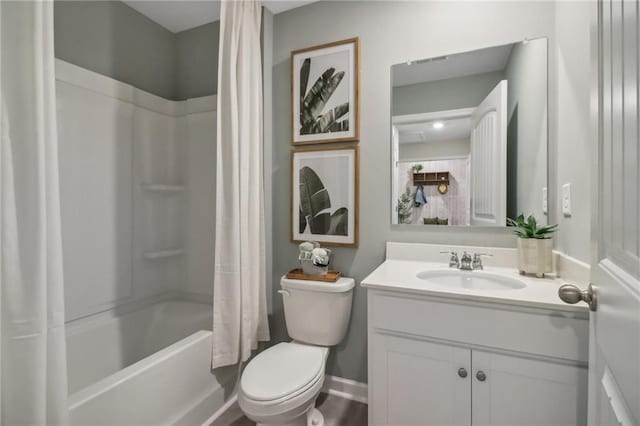 full bathroom featuring vanity, shower / bath combo, and toilet