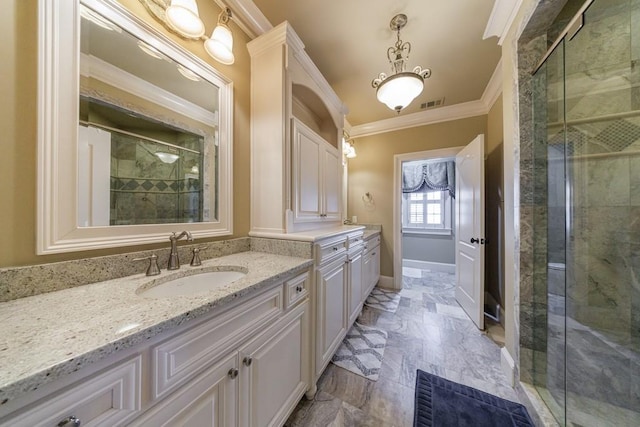 bathroom featuring vanity, a shower with door, and crown molding