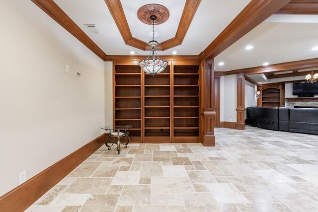 interior space with a chandelier and ornamental molding