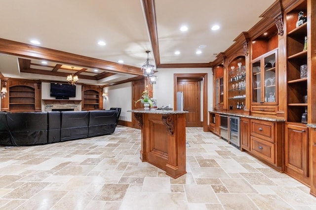 bar featuring a stone fireplace, light stone countertops, decorative light fixtures, beam ceiling, and beverage cooler