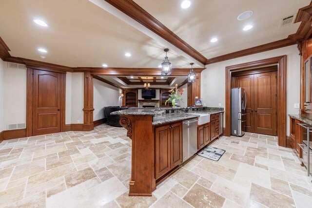 kitchen with stone counters, hanging light fixtures, beam ceiling, kitchen peninsula, and stainless steel appliances