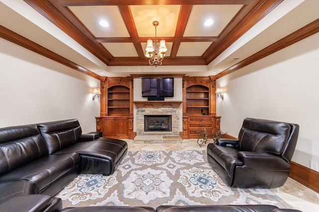 living room featuring crown molding, a fireplace, coffered ceiling, and an inviting chandelier