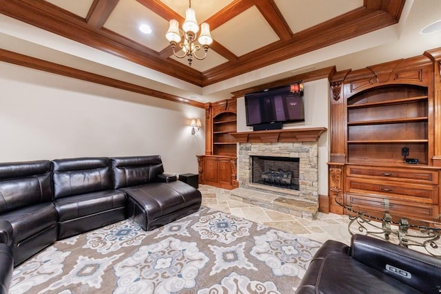 living room with ornamental molding, coffered ceiling, beam ceiling, a notable chandelier, and a stone fireplace