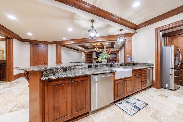 kitchen with stone counters, sink, kitchen peninsula, decorative light fixtures, and appliances with stainless steel finishes