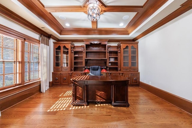 office area featuring light hardwood / wood-style floors, a tray ceiling, and crown molding