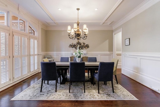 dining room featuring a chandelier, dark hardwood / wood-style floors, and ornamental molding