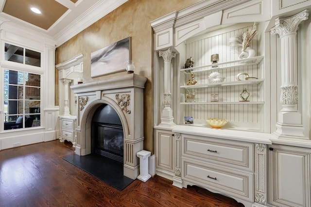 interior space featuring ornamental molding, ornate columns, and dark wood-type flooring