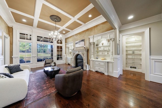 living room featuring coffered ceiling, built in shelves, ornamental molding, beam ceiling, and dark hardwood / wood-style flooring