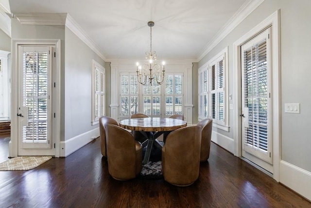 dining room with ornamental molding, dark wood-type flooring, an inviting chandelier, and a healthy amount of sunlight