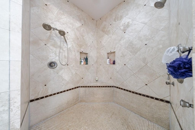 bathroom featuring tiled shower