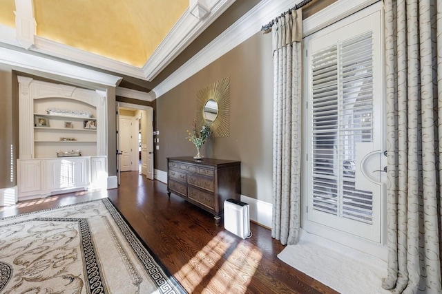 foyer entrance featuring dark hardwood / wood-style flooring and ornamental molding