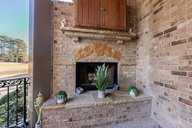 room details featuring an outdoor brick fireplace