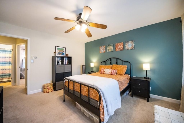 carpeted bedroom featuring ceiling fan