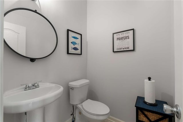 bathroom with sink and toilet