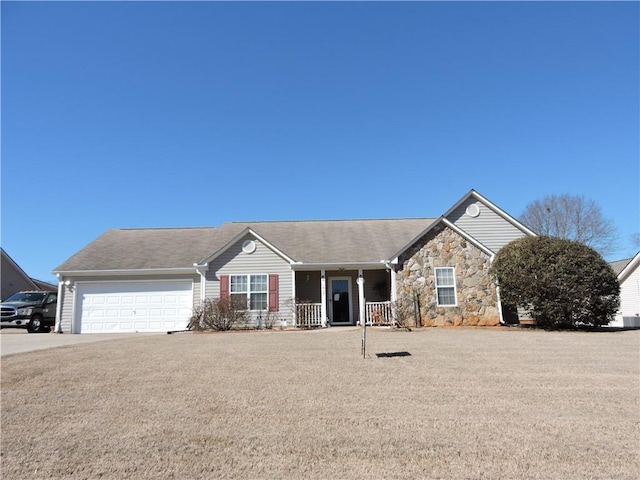 ranch-style house featuring a porch and a garage