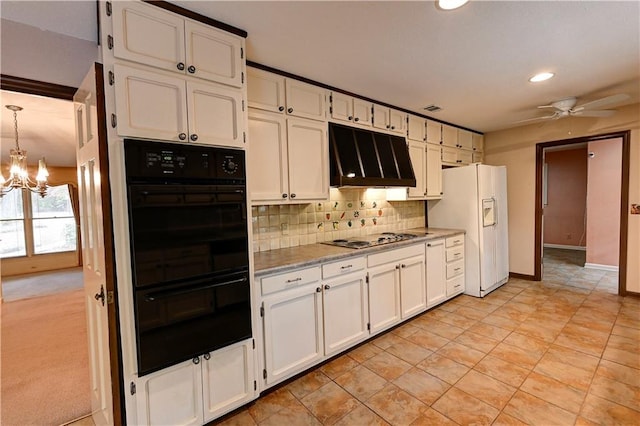 kitchen with ceiling fan with notable chandelier, light colored carpet, white cabinets, custom range hood, and black double oven