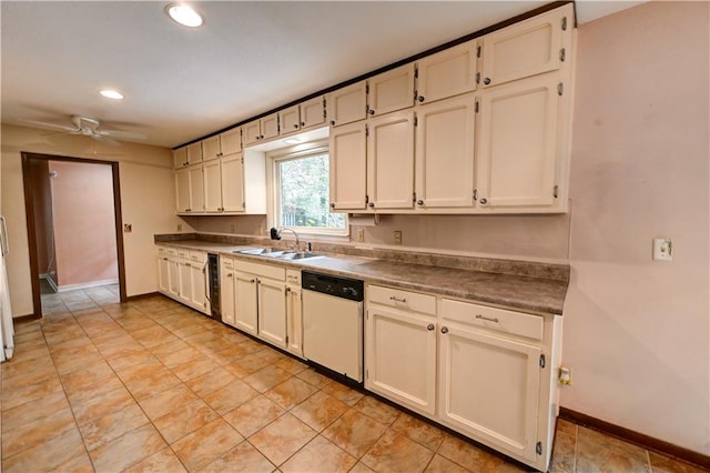 kitchen with white dishwasher, ceiling fan, white cabinets, and sink