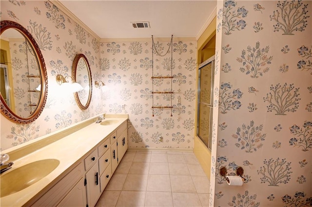 bathroom with ornamental molding, vanity, combined bath / shower with glass door, and tile patterned floors