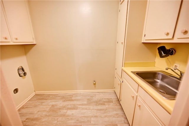 washroom featuring cabinets and sink