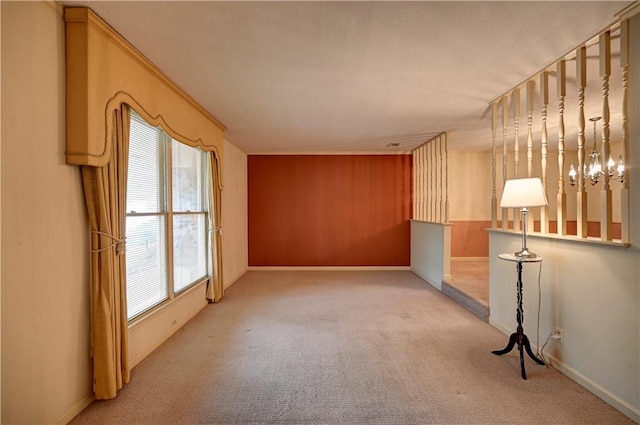 carpeted empty room with crown molding