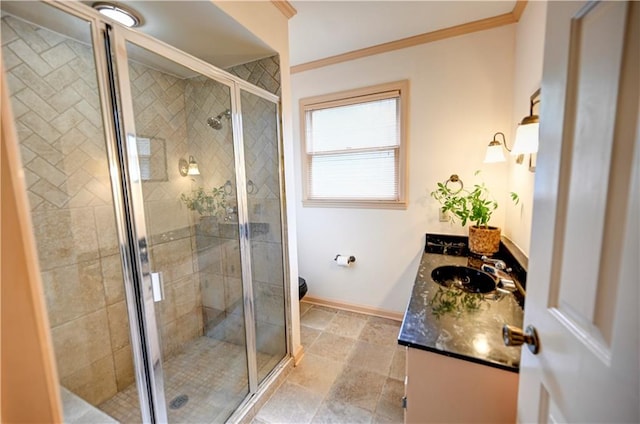 bathroom featuring walk in shower, vanity, and crown molding