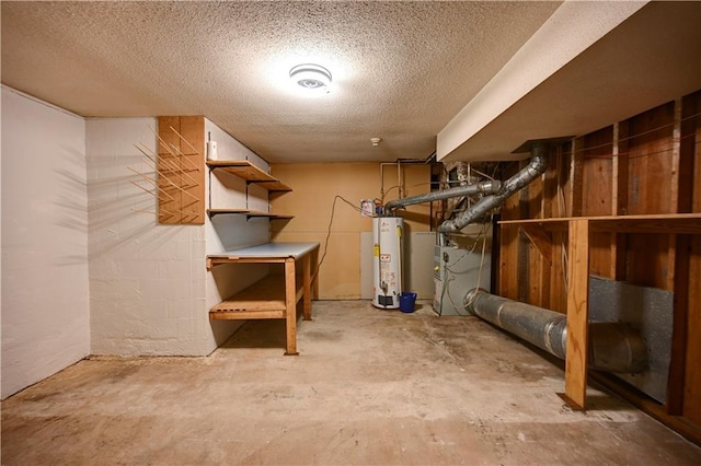 basement with water heater and a textured ceiling