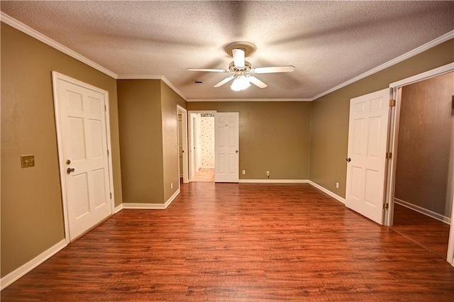 unfurnished bedroom with ceiling fan, a textured ceiling, dark hardwood / wood-style floors, and crown molding