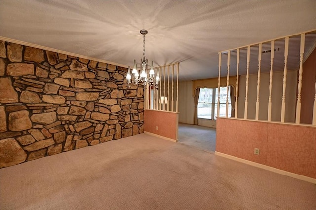 unfurnished dining area with a textured ceiling, carpet flooring, and a notable chandelier