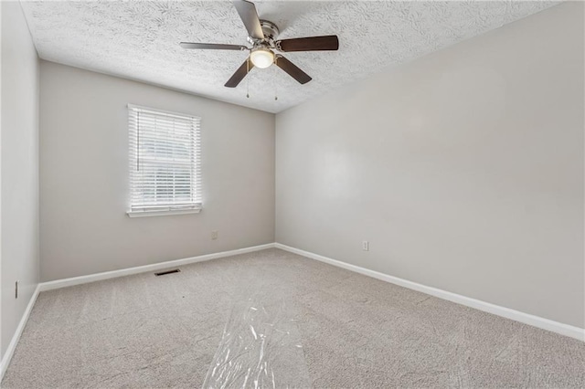 4200 Sterling Pointe Dr, Douglasville, GA 30135 - spare room with carpet flooring, baseboards, ceiling fan, and a textured ceiling