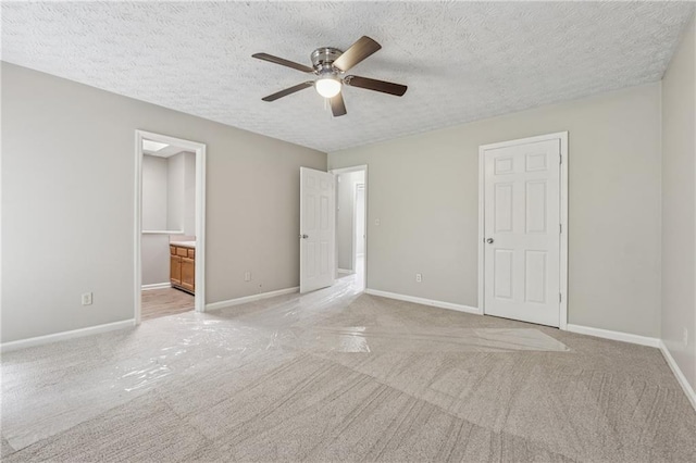 4200 Sterling Pointe Dr, Douglasville, GA 30135 - unfurnished bedroom with light carpet, baseboards, and a textured ceiling