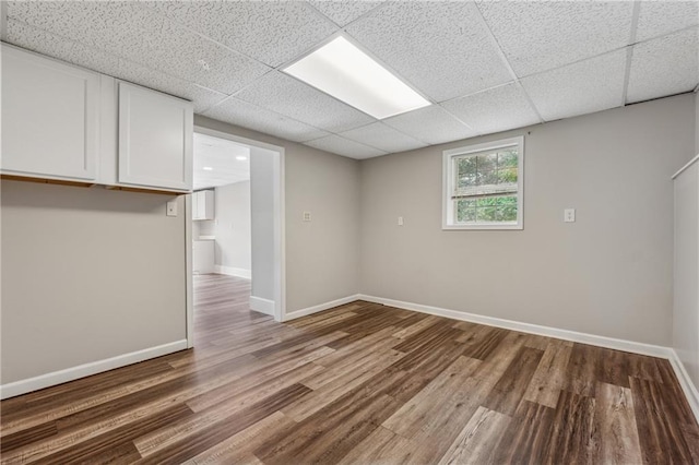 4200 Sterling Pointe Dr, Douglasville, GA 30135 - below grade area featuring wood finished floors, a paneled ceiling, and baseboards