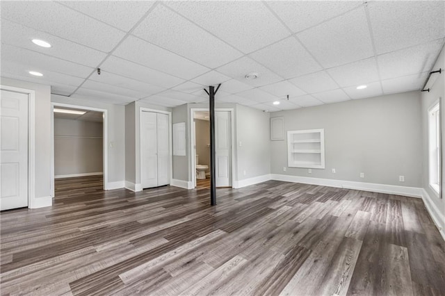 4200 Sterling Pointe Dr, Douglasville, GA 30135 - basement featuring dark wood-style flooring, baseboards, a paneled ceiling, and recessed lighting