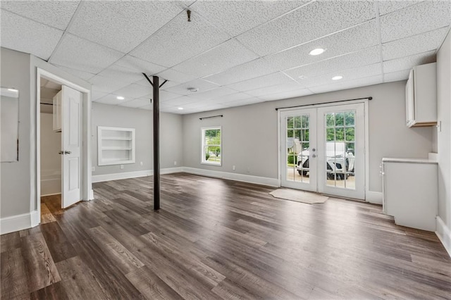 4200 Sterling Pointe Dr, Douglasville, GA 30135 - below grade area featuring dark wood-style flooring, a drop ceiling, french doors, and baseboards