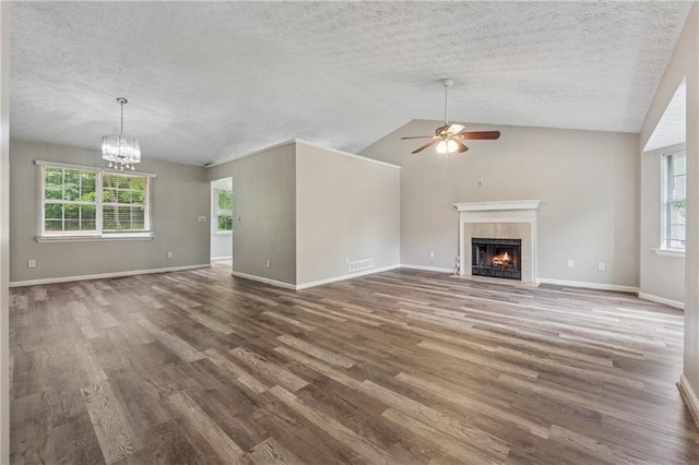 4200 Sterling Pointe Dr, Douglasville, GA 30135 - unfurnished living room with ceiling fan, wood finished floors, a tile fireplace, a textured ceiling, and vaulted ceiling