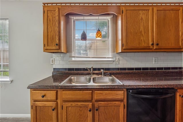 4200 Sterling Pointe Dr, Douglasville, GA 30135 - kitchen with dishwasher, a sink, backsplash, dark countertops, and baseboards