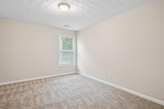 2040 Village Green Dr, Fairburn, GA 30213 - carpeted empty room featuring baseboards and a textured ceiling