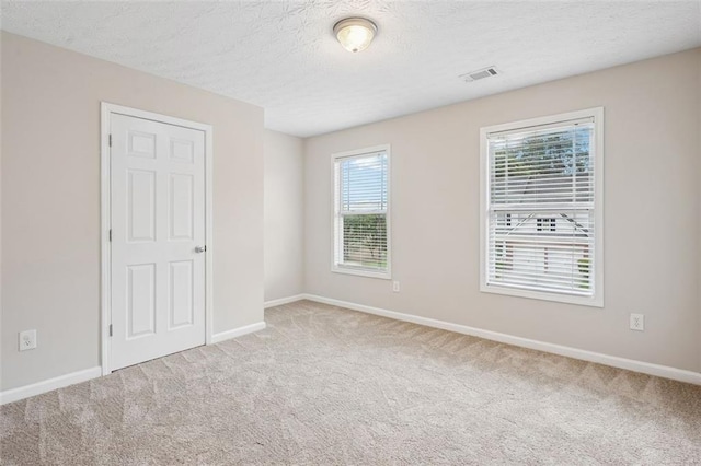 2040 Village Green Dr, Fairburn, GA 30213 - carpeted spare room with baseboards and a textured ceiling