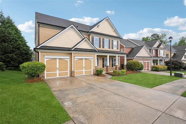 2040 Village Green Dr, Fairburn, GA 30213 - craftsman inspired home with concrete driveway, a front lawn, a garage, and covered porch